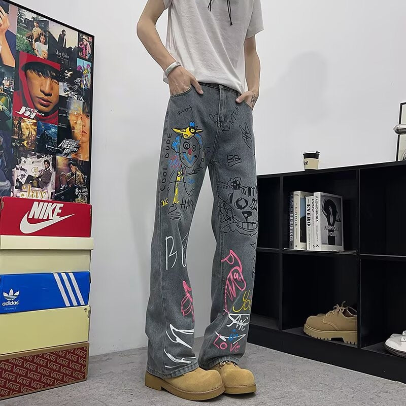 Jeans graffiti a gamba larga in denim