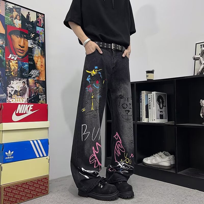 Jeans graffiti a gamba larga in denim