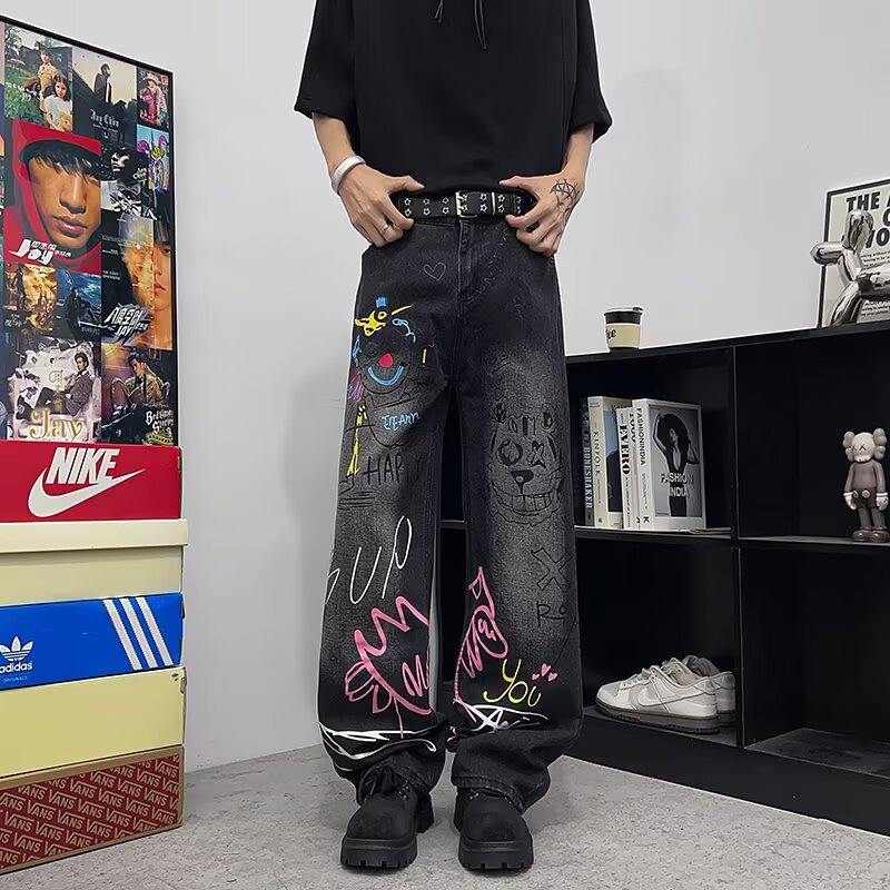 Jeans graffiti a gamba larga in denim